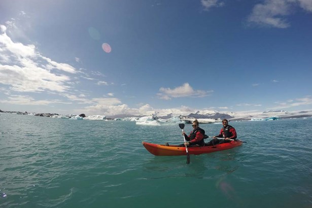 couple kayaking in Jokulsarlon glacier lagoon
