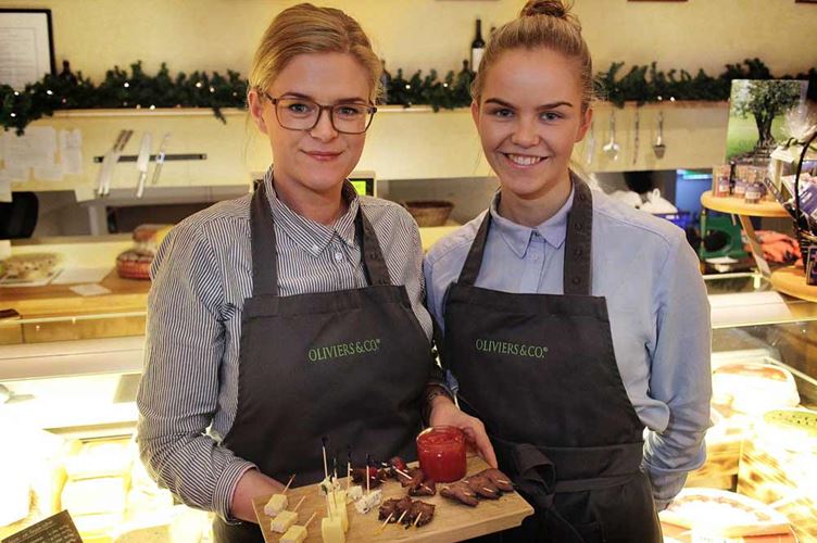 waitress at the restaurant two waitress giving snacks at the restaurant