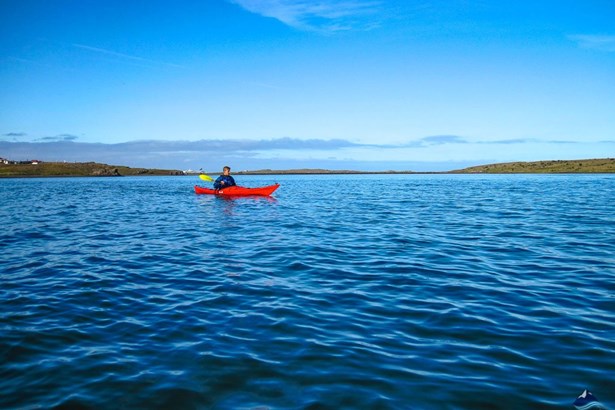 man paddling in Icelandic waters