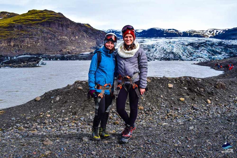 women near Solheimajokull glacier