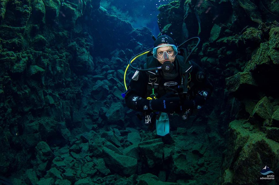 scuba diver explores underwater in Silfra