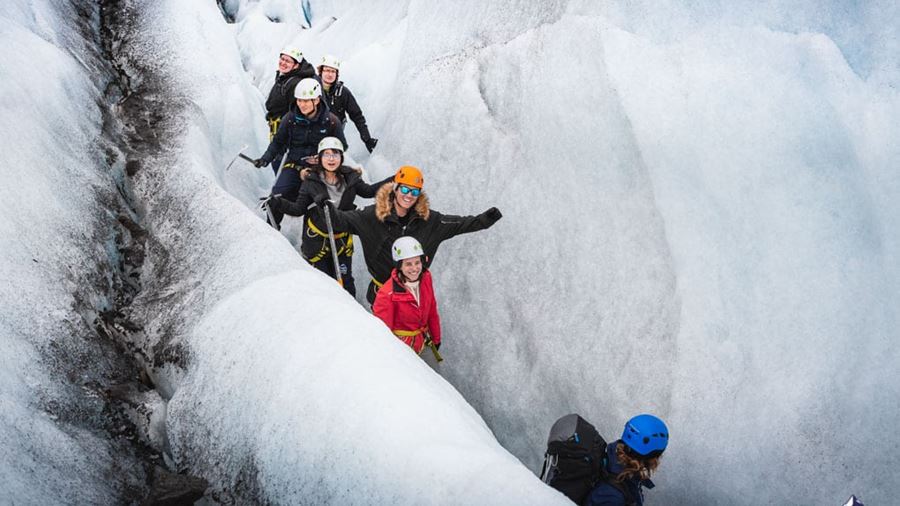 happy explorers on a glacier