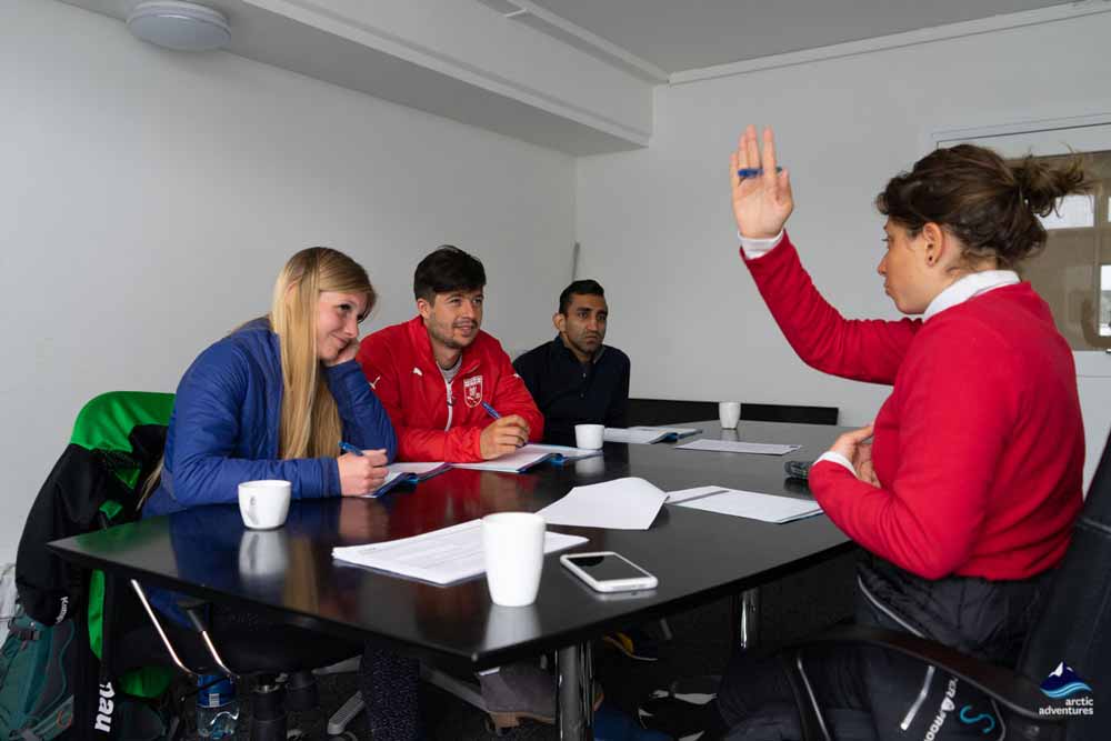instructor teaching students diving