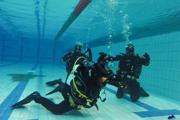 PADI course training in a pool